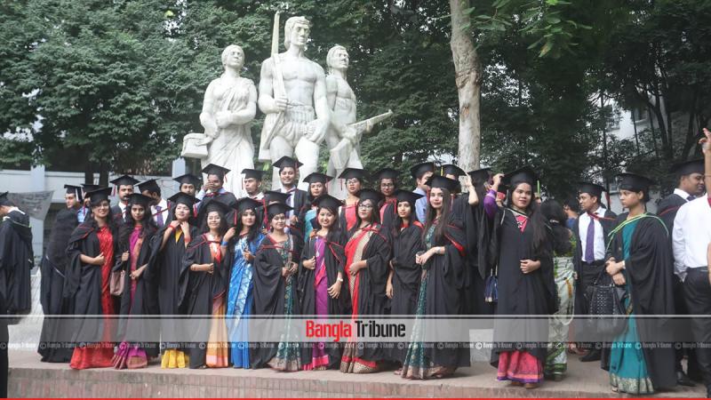 A group of graduates, wearing gown pose for picture in front of Aparajeyo Bangla on the campus on Friday (Oct 5). PHOTO/Sazzad Hossain