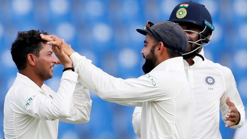 Kuldeep Yadav celebrates with captain Virat Kohli after taking a wicket. REUTERS/FILE PHOTO