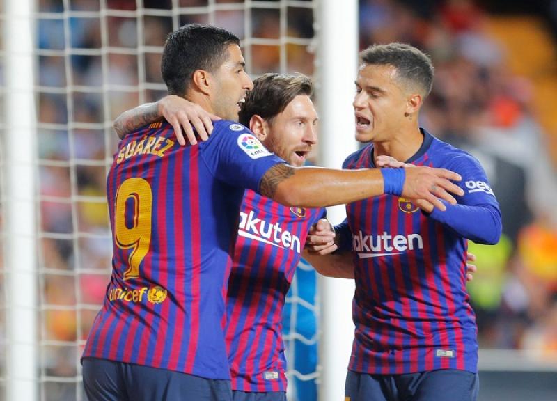 Barcelona`s Lionel Messi celebrates scoring their first goal with Luis Suarez and Philippe Coutinho at Valencia v FC Barcelona - Mestalla, Valencia, Spain - October 7, 2018. REUTERS
