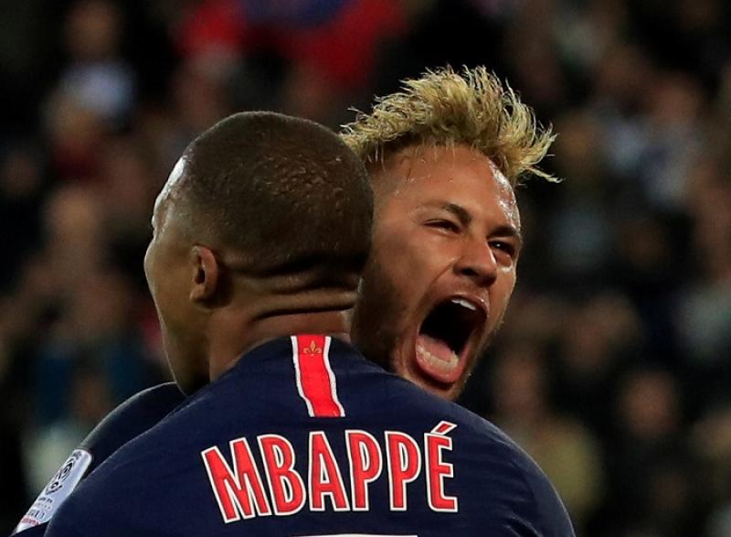 Paris St Germain`s Kylian Mbappe celebrates scoring their third goal with Neymar at Parc des Princes, Paris, France on October 7, 2018. REUTERS