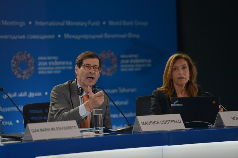 Maurice Obstfeld, Economic Counsellor and Director of IMF (L) talks as Wafa Amr, Communication Officer of IMF listens, during their press conference at the 2018 International Monetary Fund (IMF) World Bank Group Annual Meeting at Nusa Dua in Bali, Indonesia, October 9, 2018 in this photo taken by Antara Foto. REUTERS