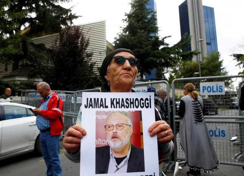 A human rights activist holds picture of Saudi journalist Jamal Khashoggi during a protest outside the Saudi Consulate in Istanbul, Turkey October 9, 2018. REUTERS