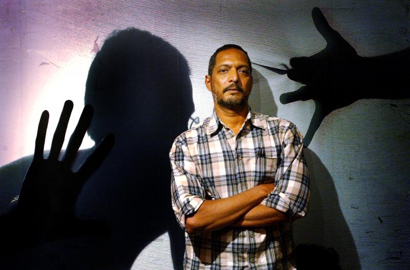 Bollywood star Nana Patekar, who plays the role of a policeman, poses for photographers during a media gathering to speak about his role in the Indian movie `Ab Tak Chhappan` (56 Until Now), in Mumbai, India March 3, 2004. REUTERS FILE PHOTO