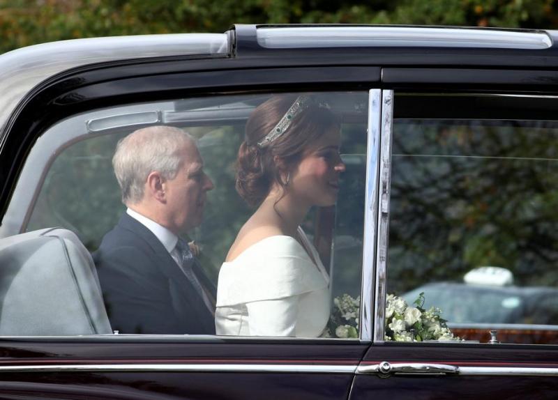 Princess Eugenie is driven towards St George`s Chapel with her father Prince Andrew, Duke of York, for her wedding to Jack Brooksbank at in Windsor Castle, Windsor, Britain October 12, 2018. REUTERS