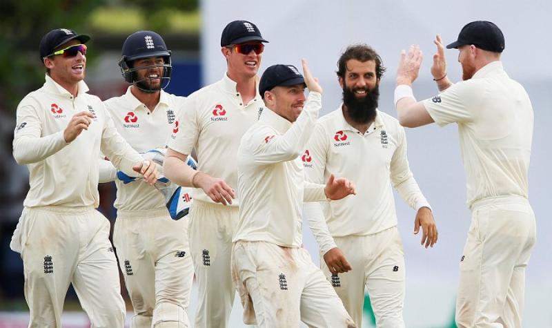 England`s Moeen Ali (2nd R) celebrates with his teammates Ben Stokes (R), Jack Leach (C), Keaton Jennings (3rd L), Ben Foakes (2nd L) and Jos Buttler after taking the wicket of Sri Lanka`s Niroshan Dickwella (not pictured) at Galle, Sri Lanka on Nov 9, 2018. REUTERS