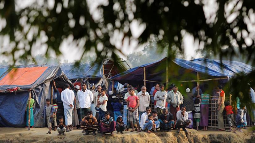 Rohingya refugees are seen at a refugee camp at no-man`s land at the Bangladesh-Myanmar border, in Cox`s Bazar, Bangladesh January 12, 2018. REUTERS