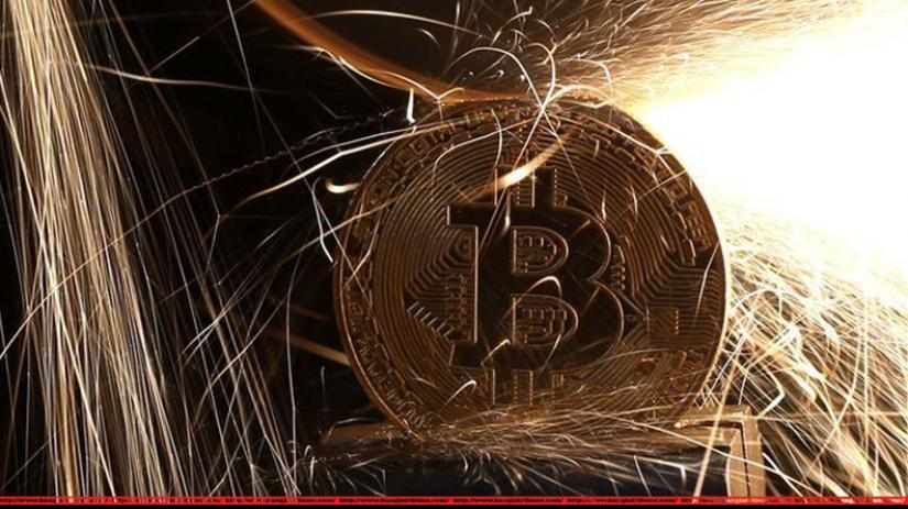 Sparks glow from broken Bitcoin (virtual currency) coins in this illustration picture, December 8, 2017. (Photo: Reuters)