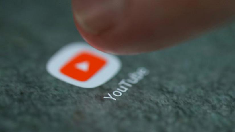 The YouTube app logo is seen on a smartphone in this picture illustration taken September 15, 2017. REUTERS