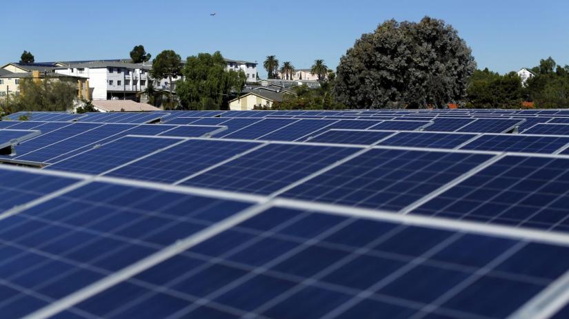 Electricity generated from solar energy will cost less than half from those from fuel-fired plants. REUTERS