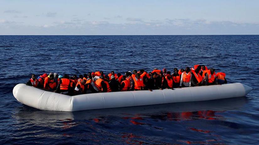 Migrants in a dinghy await rescue by the Migrant Offshore Aid Station in the Mediterranean in international waters off the coast of Libya, June 23, 2016. REUTERS FILE PHOTO