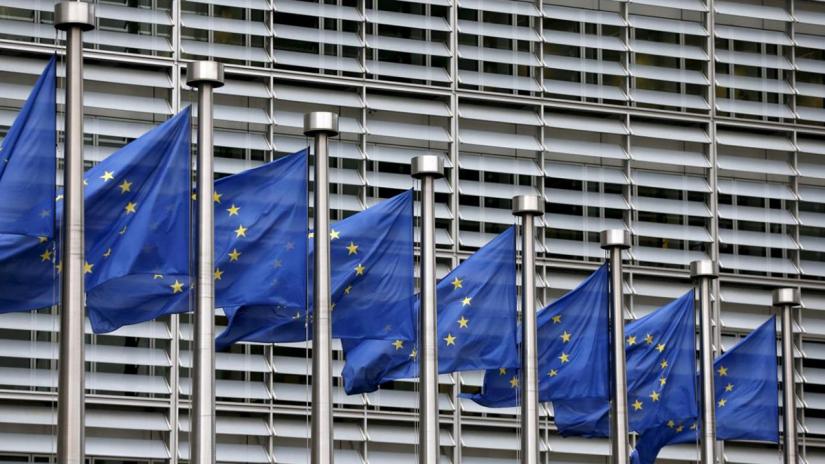 European Union flags flutter outside the EU Commission headquarters in Brussels, Belgium, in this file picture taken October 28, 2015. REUTERS