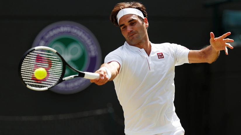 FILE PHOTO: Switzerland`s Roger Federer in action during his quarter final match against South Africa`s Kevin Anderson at All England Lawn Tennis and Croquet Club, London, Britain on Jul 11, 2018. REUTERS
