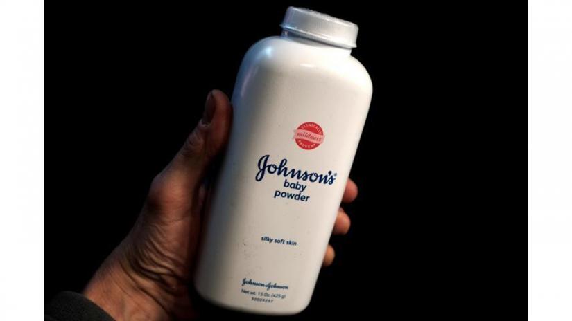 A bottle of Johnson and Johnson Baby Powder is seen in a photo illustration taken in New York, February 24, 2016. REUTERS FILE PHOTO.