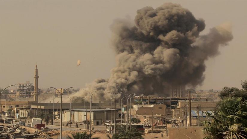 FILE PHOTO: Smoke rises after an air strike during fighting between members of the Syrian Democratic Forces and Islamic State militants in Raqqa, Syria Aug 15, 2017.
