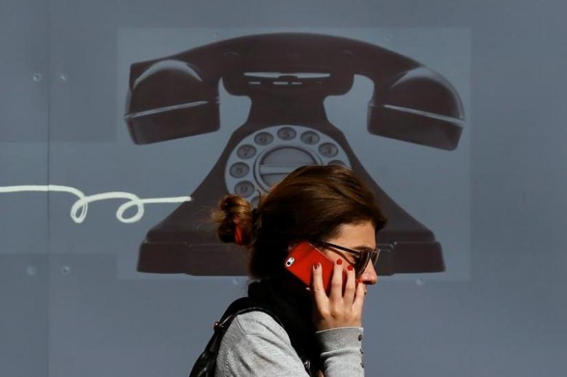 A woman talks over mobile phone. REUTERS/FILE PHOTO