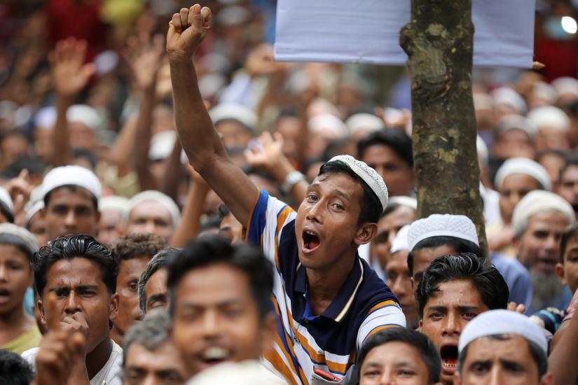 A Rohingya man shouts slogan as he takes part in a protest at the Kutupalong refugee camp to mark the one year anniversary of their exodus in Cox`s Bazar, Bangladesh, August 25, 2018. REUTERS