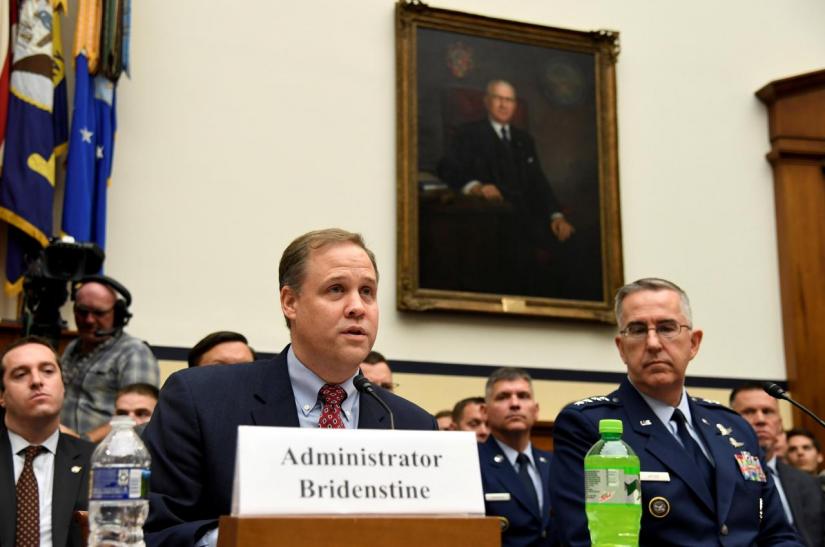 NASA Administrator Jim Bridenstine (L) makes remarks as US Strategic Command Commander Gen. John Hyten listens during the House Armed Services Strategic Forces Subcommittee`s joint hearing with the House Science, Space and Technology Committee, in Washington, U.S., June 22, 2018. REUTERS/FILE PHOTO