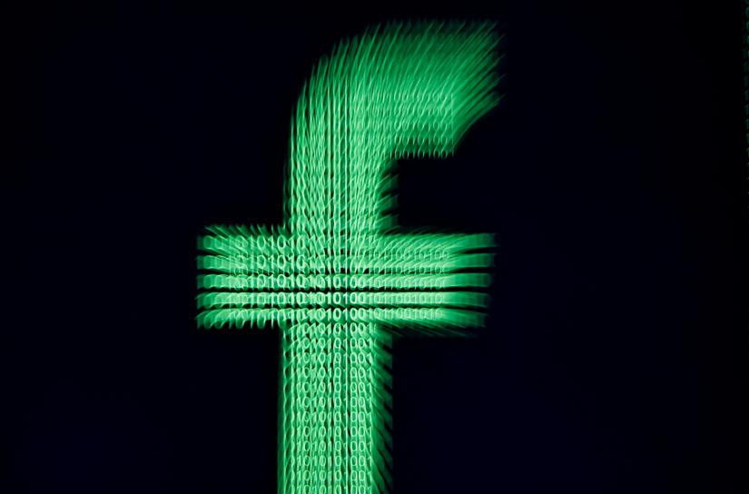 A 3D-printed Facebook logo is displayed in front of binary digits in this illustration taken March 18, 2018. REUTERS