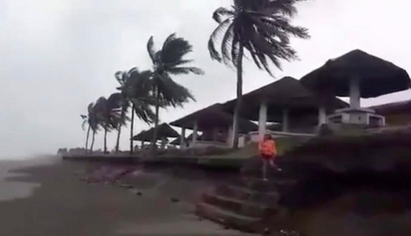 Strong winds buffet trees in Buguey, Cagayan, Philippines, Sept 14, 2018, in this still image from video obtained from social media. REUTERS