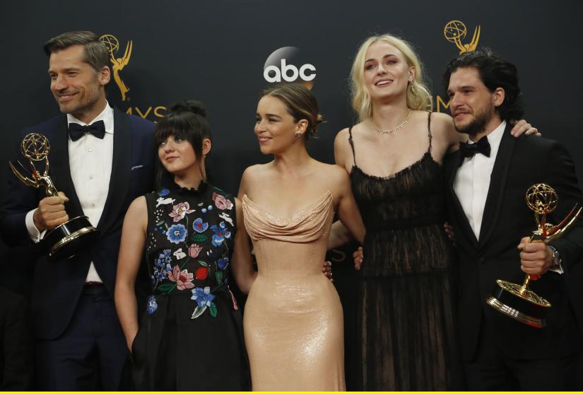 Nikolaj Coster-Waldau (L), Maisie Williams, Emilia Clarke, Sophie Turner and Kit Harrington of HBO`s `Game of Thrones` pose backstage with their award for Oustanding Drama Series at the 68th Primetime Emmy Awards in Los Angeles, California U.S., September 18, 2016. REUTERS FILE PHOTO