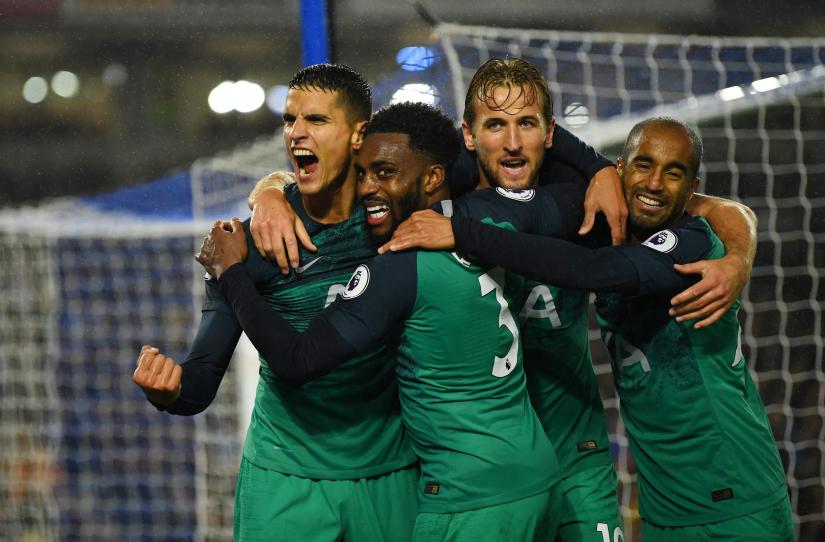 Tottenham`s Erik Lamela celebrates scoring their second goal with Harry Kane and team mates. REUTERS