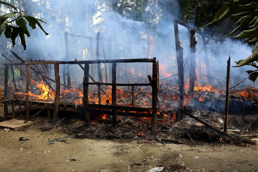 A house is seen on fire in Gawduthar village, Maungdaw township, in the north of Rakhine state, Myanmar. REUTERS/FILE PHOTO