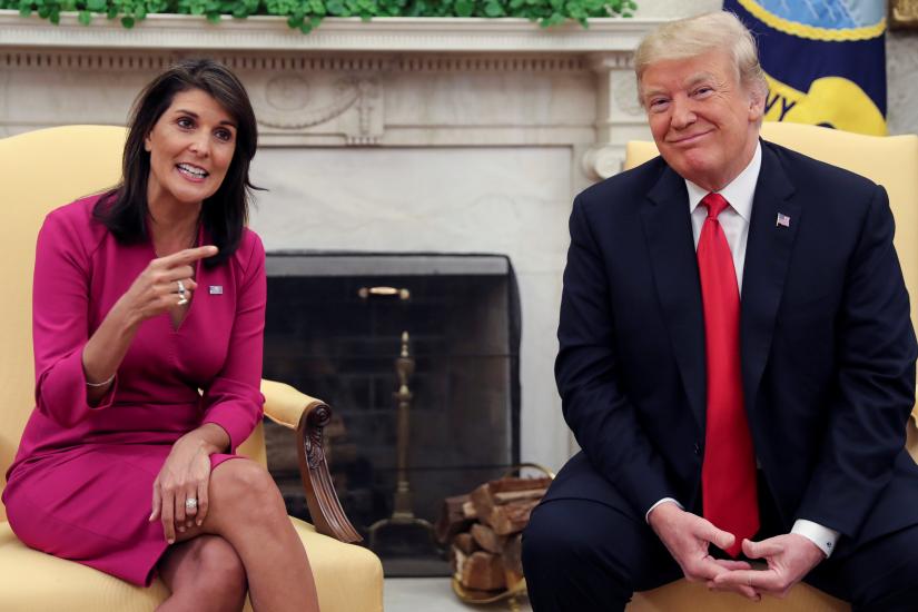 Outgoing US Ambassador to the United Nations Nikki Haley talks with US President Donald Trump in the Oval Office of the White House after the president accepted Haley`s resignation in Washington, US, October 9, 2018. REUTERS