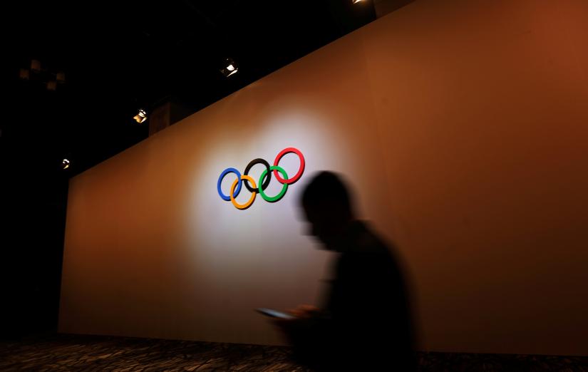 A man walks past the Olympic Rings as he walks out of the 133rd International Olympic Committee (IOC) session in Buenos Aires, Argentina Oct 8. REUTERS