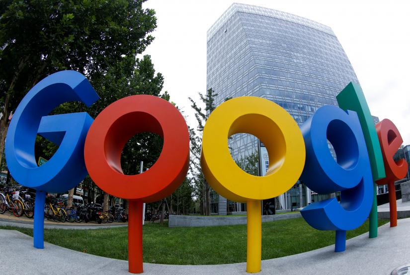 The brand logo of Alphabet Inc`s Google is seen outside its office in Beijing, China August 8, 2018.  Picture taken with a fisheye lens. REUTERS FILE PHOTO