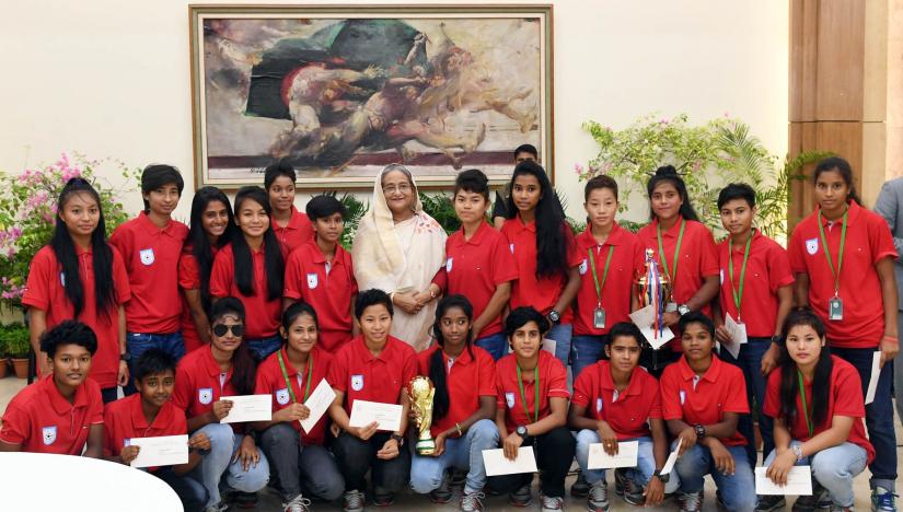 Prime Minister Sheikh Hasina poses for picture with the Bangladesh U-16 Women Football Team at Ganabhaban on Thursday (Oct 11).