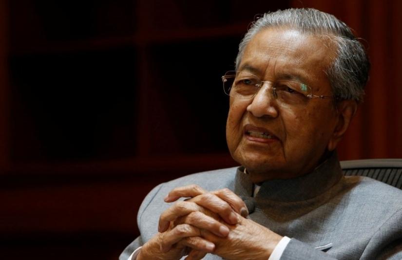 Malaysia`s Prime Minister Mahathir Mohamad speaks during an interview with Reuters in June, 2018. REUTERS/file photo