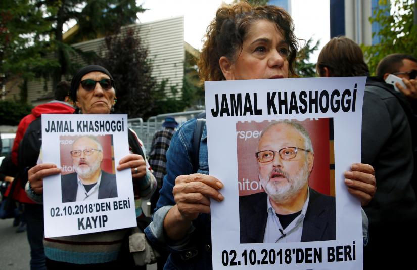 Human rights activists hold pictures of Saudi journalist Jamal Khashoggi during a protest outside the Saudi Consulate in Istanbul, Turkey October 9, 2018. REUTERS