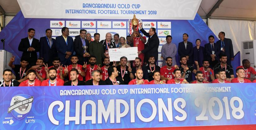Members of Palestine team pose for picture with Prime Minister Sheikh Hasina in Dhaka’s Bangabandhu National Stadium on Friday (Oct 12) after clinching the title of the 5th edition of Bangabandhu International Gold Cup Football tournament. PID