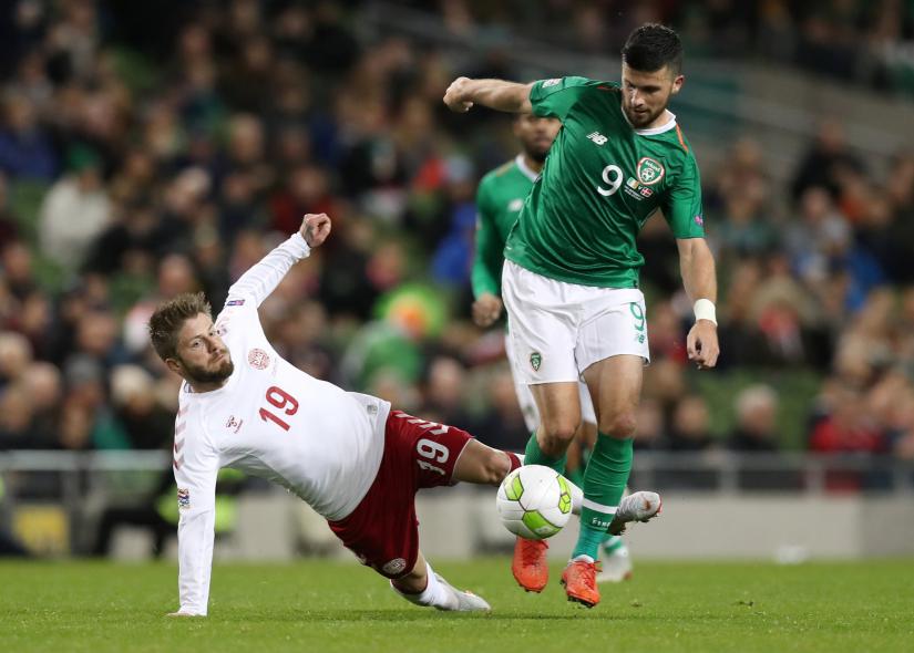 Republic of Ireland`s Shane Long in action with Denmark`s Lasse Schone during UEFA Nations League Match on Oct 13.Action images via REUTERS