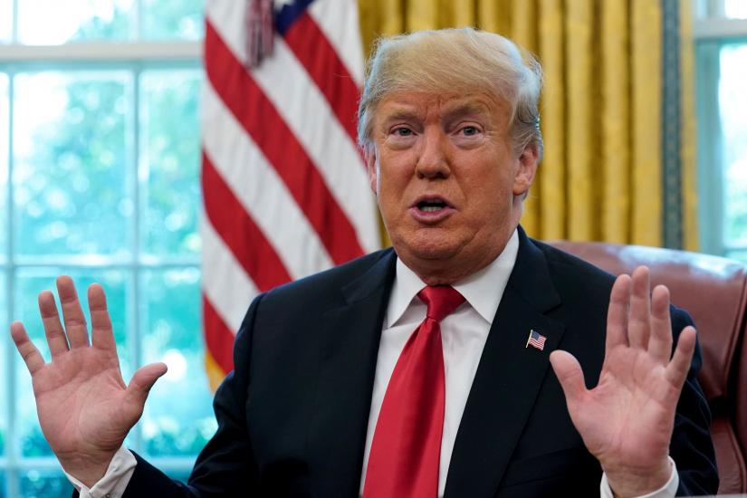US President Donald Trump speaks to reporters in the Oval Office at the White House in Washington, US Oct 10, 2018. REUTERS/file photo