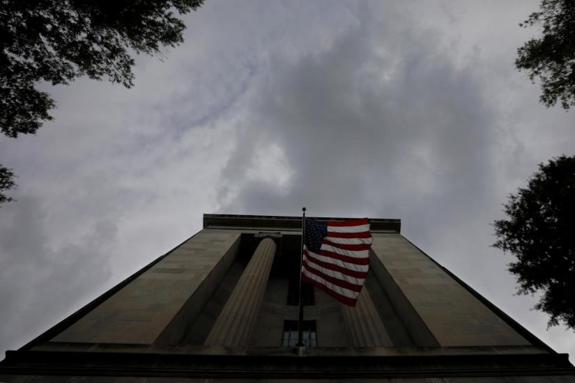 A US flag flies at the headquarters of the Department of Justice in Washington, US. REUTERS/file photo