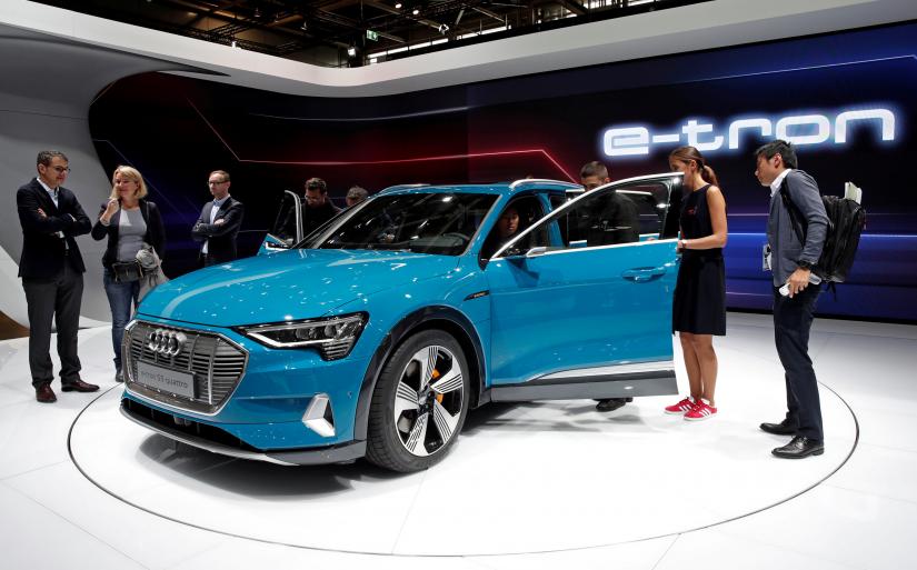 People inspect the Audi E-Tron 5S Quattro during the first press day at the Paris auto show, Paris, France, Oct 2, 2018. REUTERS/file photo