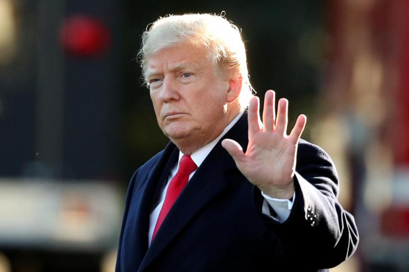 US President Donald Trump waves prior to departing on a trip to Wisconsin from the White House in Washington, U.S., October 24, 2018. REUTERS/FILE PHOTO