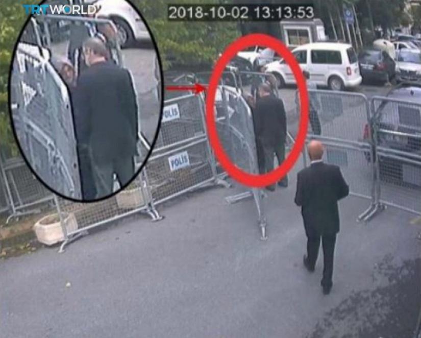 A still image taken from CCTV video and obtained by TRT World claims to show Saudi journalist Jamal Khashoggi, highlighted in a red circle by the source, as he stands with his fiancee Hatice Cengiz outside the Saudi Arabia`s Consulate in Istanbul, Turkey October 2, 2018. Courtesy TRT World/Handout via REUTERS