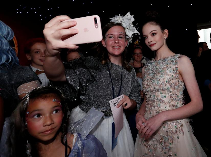 Cast member Mackenzie Foy poses with fans at the premiere for 'The Nutcracker and the Four Realms' in Los Angeles, California, U.S., October 29, 2018. REUTERS