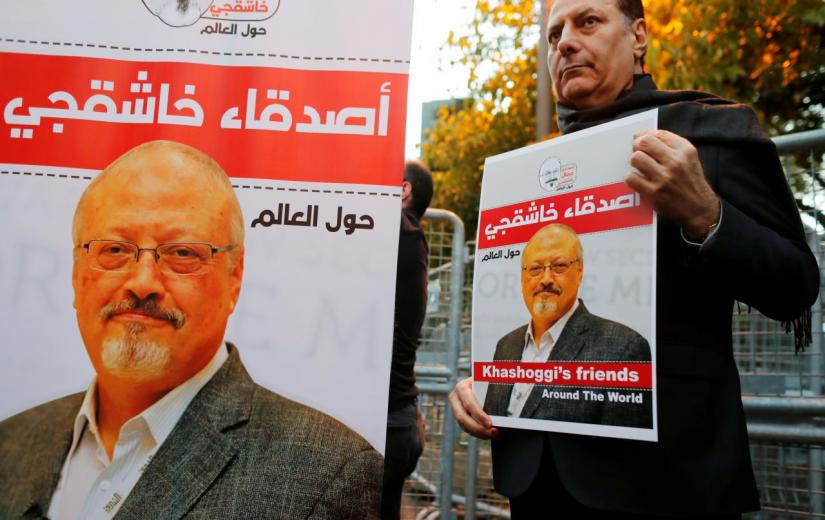 Friends of Saudi journalist Jamal Khashoggi hold posters and banners with his pictures during a demonstration outside the Saudi Arabia consulate in Istanbul, Turkey October 25, 2018. REUTERS/FILE PHOTO