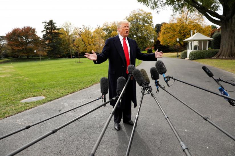 U.S. President Donald Trump speaks to reporters before departing on a campaign trip on the South Lawn of the White House in Washington, U.S., November 2, 2018. REUTERS/FILE PHOTO