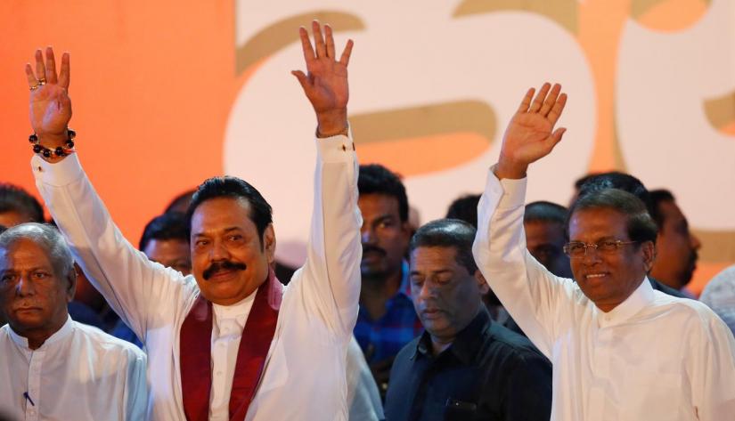 Sri Lanka`s newly appointed Prime Minister Mahinda Rajapaksa and President Maithripala Sirisena wave at their supporters during a rally near the parliament in Colombo, Sri Lanka November 5, 2018. REUTERS/FILE PHOTO