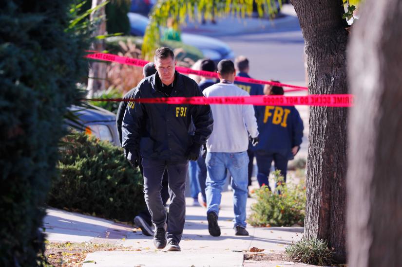 Police and FBI officers wait outside the home of the suspect in a shooting incident at a Thousand Oaks bar, in Newbury Park, California, US November 8, 2018. REUTERS