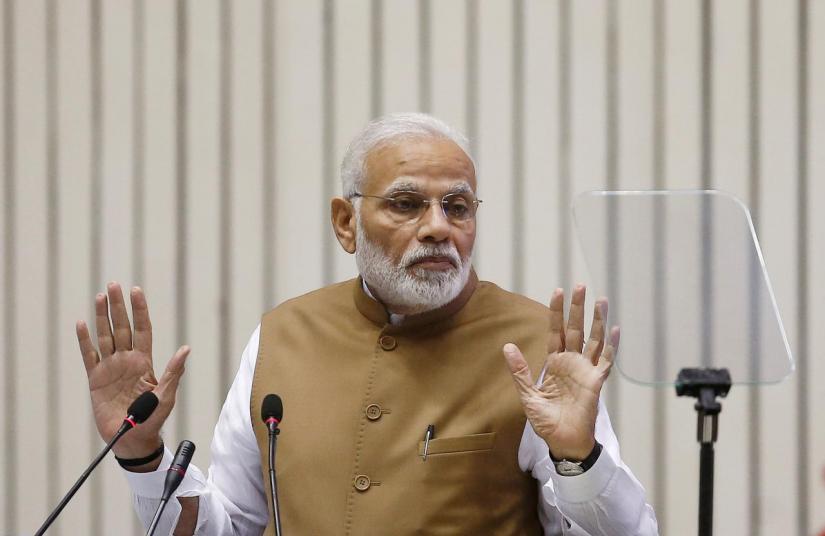 India`s Prime Minister Narendra Modi gestures as he addresses the gathering during the `Global Mobility Summit` in New Delhi, India, September 7, 2018. REUTERS/FILE PHOTO