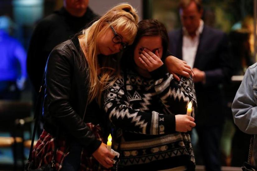 Mourners attend a vigil for the victims of the mass shooting, at the Thousand Oaks Civic Arts Plaza in Thousand Oaks, California, U.S. November 8, 2018. REUTERS