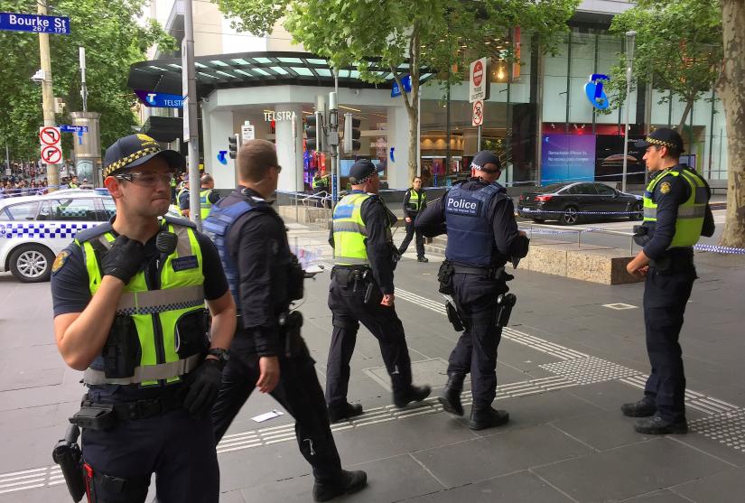 Policemen stop members of the public from walking towards the Bourke Street mall in central Melbourne, Australia, November 9, 2018. REUTERS