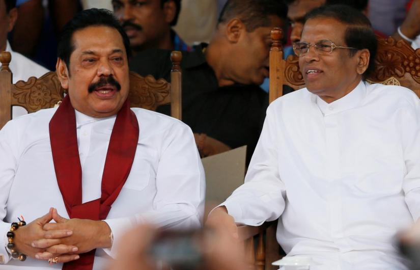 Sri Lanka`s newly appointed Prime Minister Mahinda Rajapaksa and President Maithripala Sirisena talk during a rally near the parliament in Colombo, Sri Lanka November 5, 2018. REUTERS