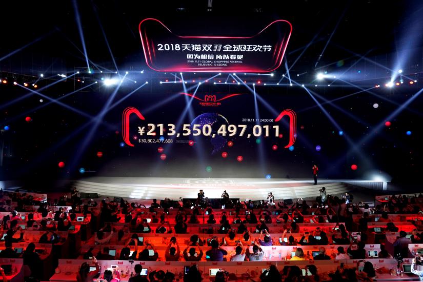 A screen shows the value of goods being transacted at Alibaba Group`s 11.11 Singles` Day global shopping festival in Shanghai, China, November 12, 2018. REUTERS