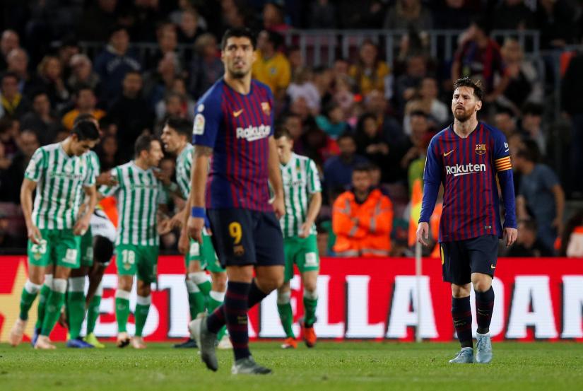 La Liga Santander - FC Barcelona v Real Betis - Camp Nou, Barcelona, Spain - November 11, 2018 Barcelona`s Lionel Messi and Luis Suarez looks dejected as Real Betis` Sergio Canales celebrates scoring their fourth goal with team mates REUTERS